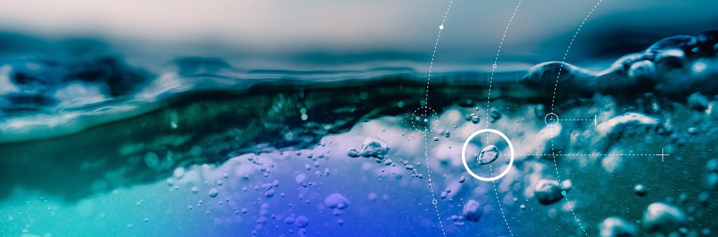 Undersea water bubbles with circular graphics on top of the image. The bubbles metaphorically represent data