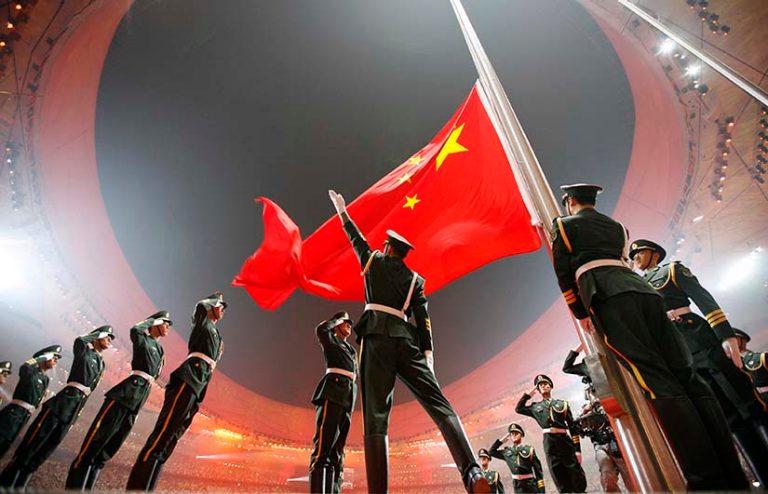 China's national flag is raised during the opening ceremony of the Beijing 2008 Olympic Games at the National Stadium in this August 8, 2008 file photo.  REUTERS/Jerry Lampen