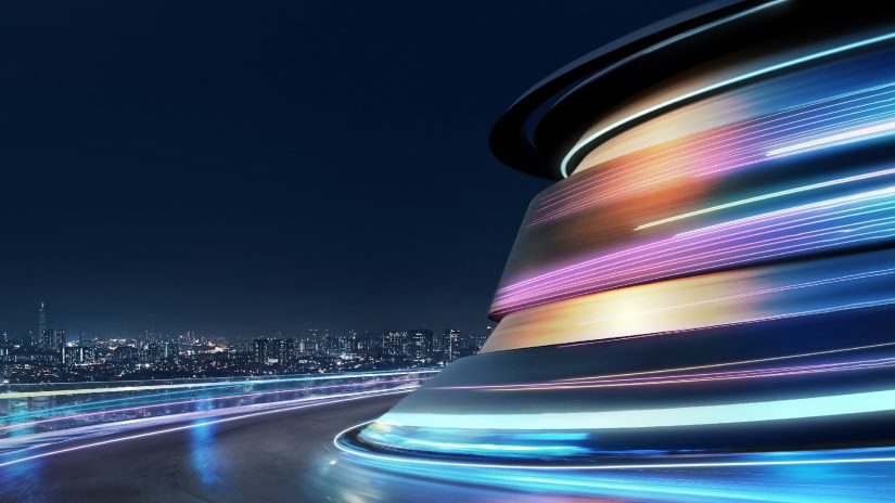 Abstract motion curvy road with neon light motion effect with backdrop of a cityscape